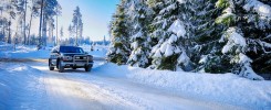 Winter road with car